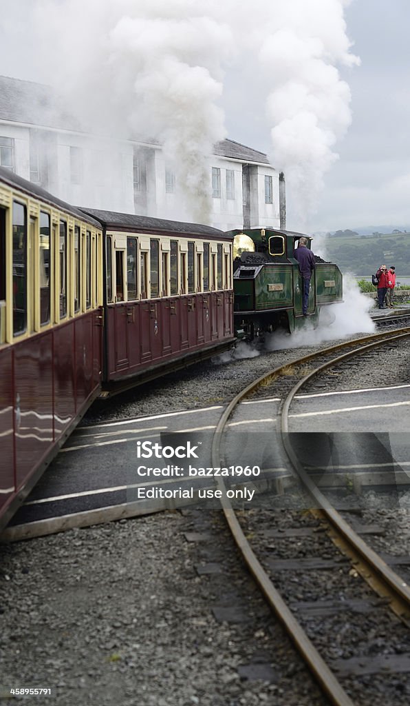 Ffestiniog & Welsh Highland Railways. "Porthmadog, Gwynedd, Wales - June 24 - 2012, Steam Locomotive leaving Porthmadog railway station which forms part of the Ffestiniog & Welsh Highland Railways." Color Image Stock Photo