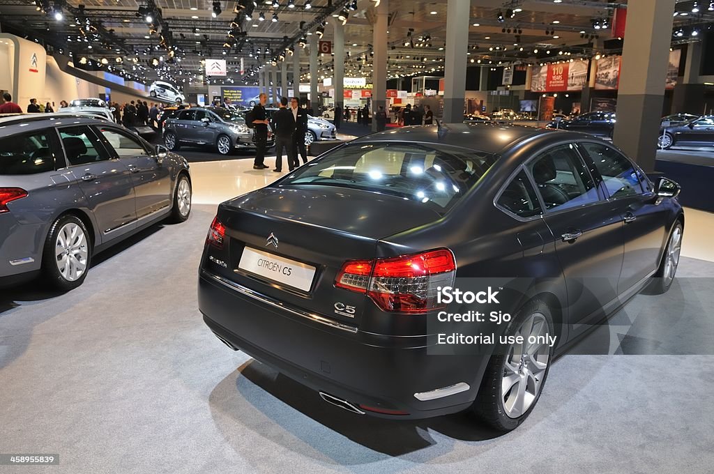 Citroen C5 Brussels, Belgium - January 10, 2012: Citroen C5 sedan on display during the 2012 Brussels motor show. People in the background are looking at the cars. Behind Stock Photo