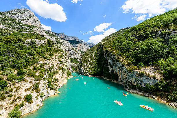 Gorges du Verdon "Verdon, France - July 7, 2012: France on Vacation - Tourists enjoying a warm summer day in the Gorges du Verdon; renting boats to explore the gorges or feeling adventurous and even going for a swim." alpes de haute provence photos stock pictures, royalty-free photos & images