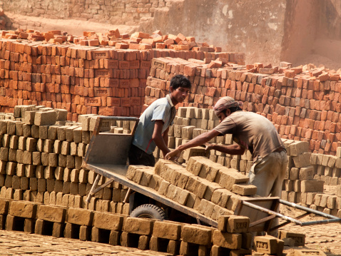 Goiania, Goiás, Brazil – July 08, 2022:  Ceramic bricks arranged in piles and stored outdoors for sale.