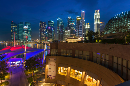 Aerial view of Singapore cityscape at dusk. Landscape of Singapore Marina bay with modern buildings and skyscrapers at night