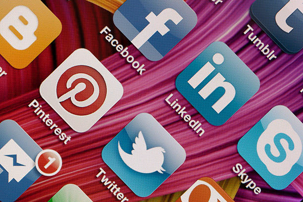 Social Media Apps on Apple iPhone 4 Screen "Antalya, TURKEY - March 19, 2012: A close up of an Apple iPhone 4 screen showing various social media apps, including Blogger, Facebook, Tumblr, Pinterest, Linkedin, Twitter, Skype, and Facebook Messenger. Apple iPhone one of the most wanted and powerful smartphone on the world wide" pinterest stock pictures, royalty-free photos & images
