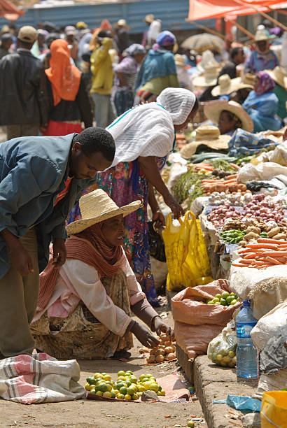 Ethiopian Market "Addis Ababa, Ethiopia - March 29, 2012: Market vendors busy with their mechandise, on the Mercato market in Ethiopia. This market is the biggest outdoor market in the world." ethiopia city stock pictures, royalty-free photos & images