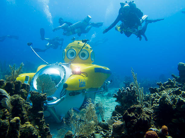 Divers surround submarine stock photo