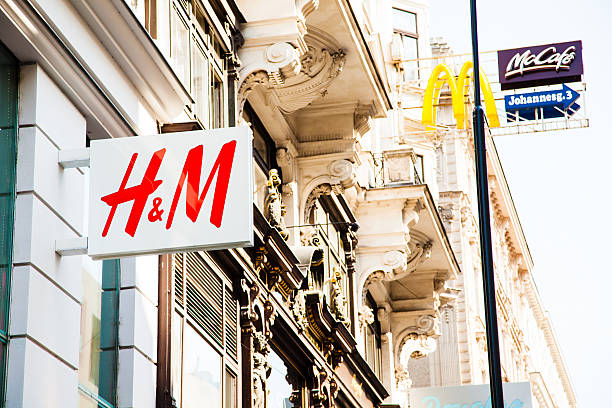 H&amp;M and McDonald's sign "Vienna, Austria - July 5, 2012: HM and Mc Donald's sign in the centre of Vienna, Austria." h and m stock pictures, royalty-free photos & images