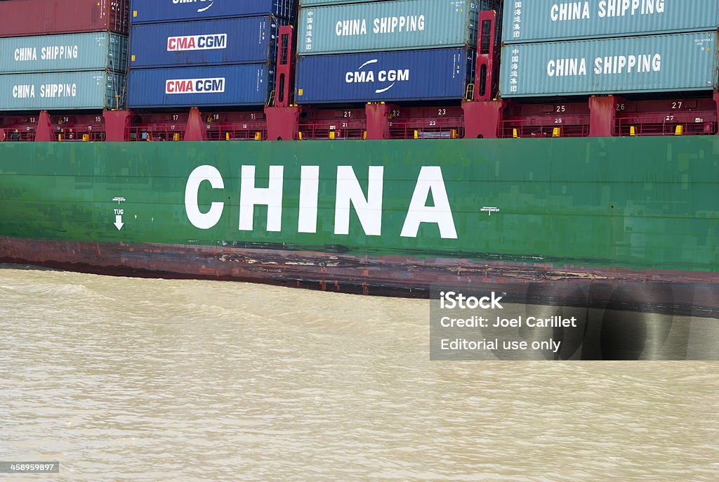 Container ship from China transiting the Panama Canal Panama Canal, Panama - December 24, 2008: A ship operated by China Shipping Container Lines Co., Ltd (CSCL), moves through the Panama Canal. A division of China Shipping Group (China Shipping), it is a containerized marine shipping company, based in Shanghai. China - East Asia Stock Photo