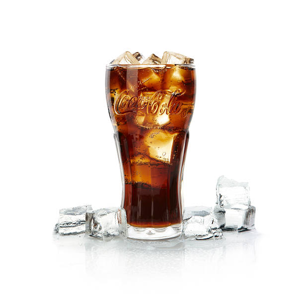 Glass of Coca-Cola with ice. "Istanbul, Turkey - March 10, 2012: a Glass of Coca-Cola with Ice. Coca-Cola is a carbonated soft drink produced by The Coca-Cola Company." coke coal stock pictures, royalty-free photos & images