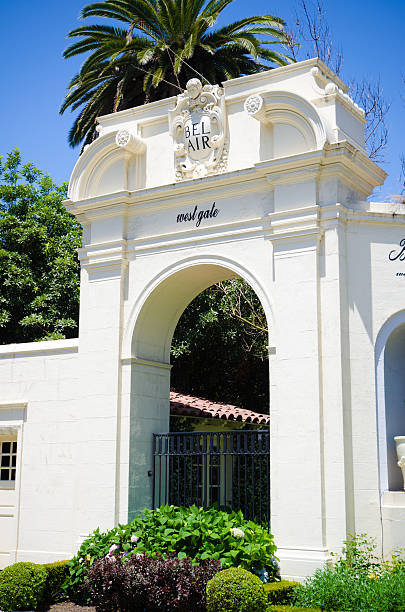 Gate at entrance to Bel-Air in Los Angeles, CA "Los Angeles, United States - May 29, 2012: Gate located at the entrance to the affluent residential community of Bel-Air along Sunset Boulevard, just north of the UCLA campus." bel air photos stock pictures, royalty-free photos & images