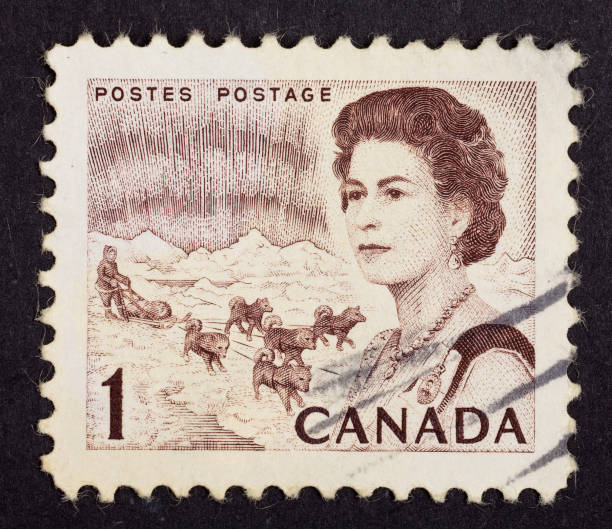 Queen Elizabeth II postage stamp "Istanbul, Turkey - December 17, 2011 : Close-up postage stamp on black background. Canada postage stamp with Queen elizabeth II" elizabeth ii photos stock pictures, royalty-free photos & images