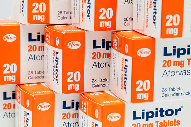 Boxes of Atorvastatin (Lipitor) tablets "Aberdeen, Scotland - April 17, 2012: Boxes of Atorvastatin (Lipitor) tablets.  Atorvastatin is a member of the drug class known as statins, used for lowering blood cholesterol levels." statin photos stock pictures, royalty-free photos & images