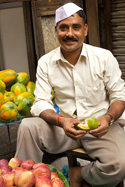 Indian street vendor selling fruit stock photo