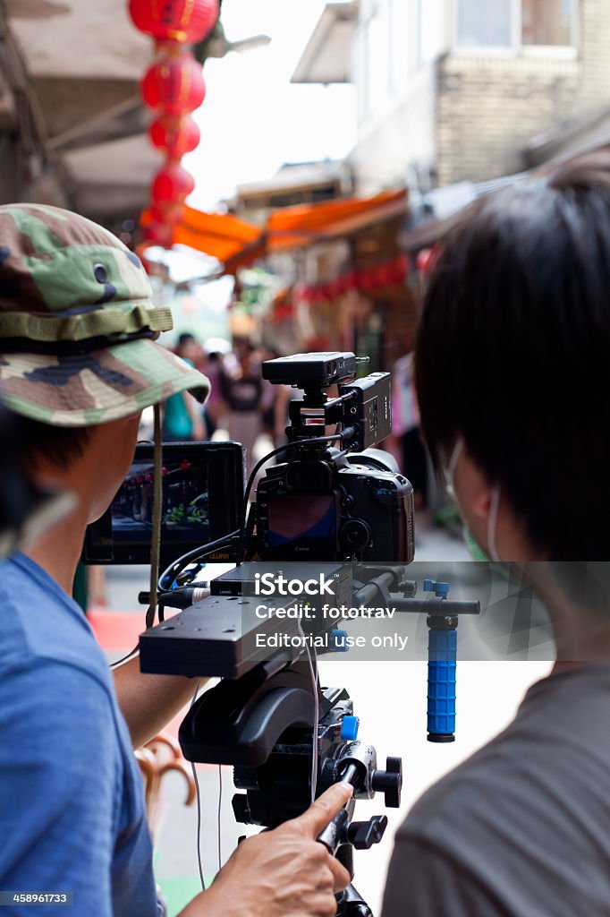 Dois unreconizable cinegrafista usando uma Canon 5D Mark II - Foto de stock de Adulto royalty-free