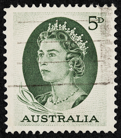 Exeter, United Kingdom - February 1, 2010: British Two and a Half Pence Red Used Postage Stamp showing Portrait of Queen Elizabeth 2nd, printed and issued between 1952 to 1965
