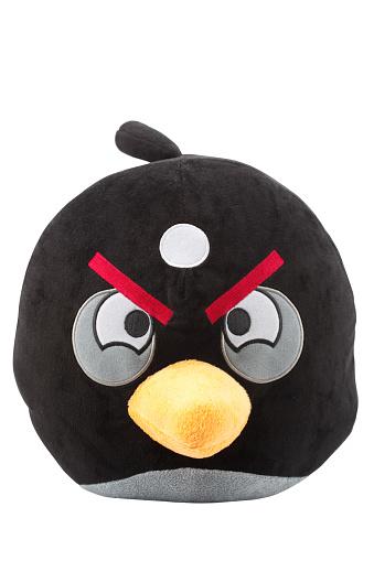 Cantley, Quebec, Canada - February 23, 2012: This is a Black Angry bird fluffy toy. This Angry Bird is part of the video game Angry Birds and is one of the most popular games across all platforms.