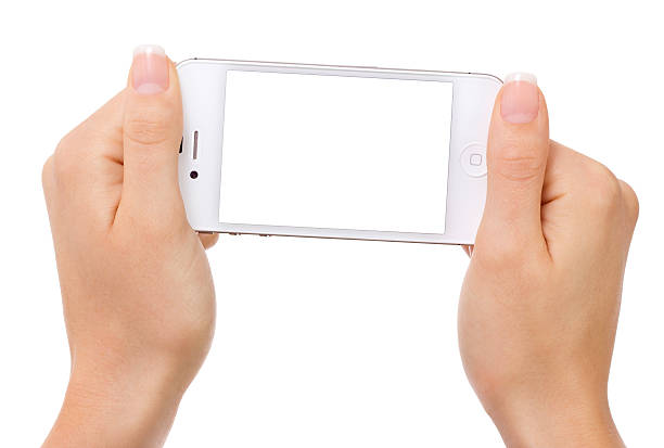 手のクローズアップを持つ携帯電話 - iphone holding hands isolated communications technology ストックフォトと画像