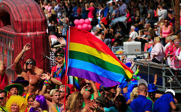 gay canal parade, amsterdam - city amsterdam urban scene gay parade stock-fotos und bilder