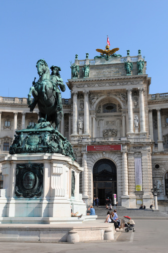 Vienna, Austria - June 8, 2023: Street view in center of Vienna city, Austria in the morning. Cityscape of capital with cars, buildings, street, store.