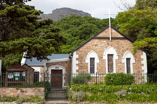 Hout Bay, South Africa - January, 4th 2012: Anglican church of St Peter, built of stone on the main road in Hout Bay, Western Cape, South Africa. It seats only 80 people.