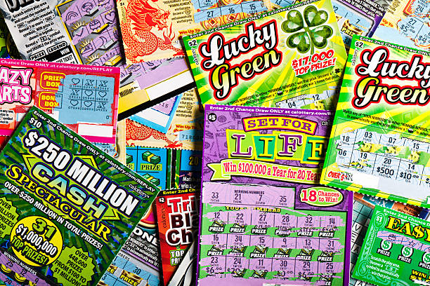 batch of scratched lottery tickets stock photo