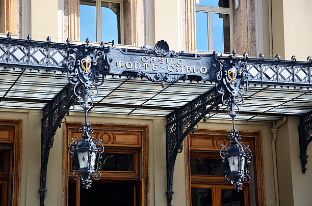 Monte Carlo, Monaco  -October 23, 2025: This stock photo captures a sunny-day view of the Hotel Hermitage Monte-Carlo and its surrounding buildings in the heart of Monaco’s Monte Carlo district. Opened in the early 20th century, the Hermitage is a historic Belle Époque hotel known for its elegant architecture, ornate façades, and luxurious interiors. The image highlights the hotel’s classic pastel-colored exteriors, decorative ironwork, and refined design, while also showing nearby buildings and the charming urban landscape of Monte Carlo.Notably, the hotel gained international attention in 1999 when prominent banker Edmond Safra tragically died during a fire in his luxury apartment within the Hermitage complex, an event widely reported in global media. This scene reflects both Monaco’s luxurious lifestyle and a significant historical moment associated with the hotel.
