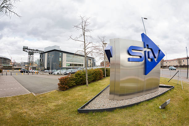 STV (Scottish Television) Headquarters "Glasgow, UK - April 8, 2013: STV sign outside the STV headquarters and studios building at Pacific Quay on the south bank of the River Clyde in Glasgow. STV serves central and northern scotland, producing and broadcasting programmes on the ITV (Independent Television) network." itv photos stock pictures, royalty-free photos & images