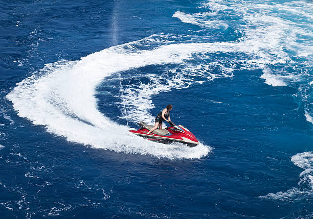 Koh Samui, Thailand - December 30, 2010: Man running a jet-ski wave runner in the sea near the Samui Island