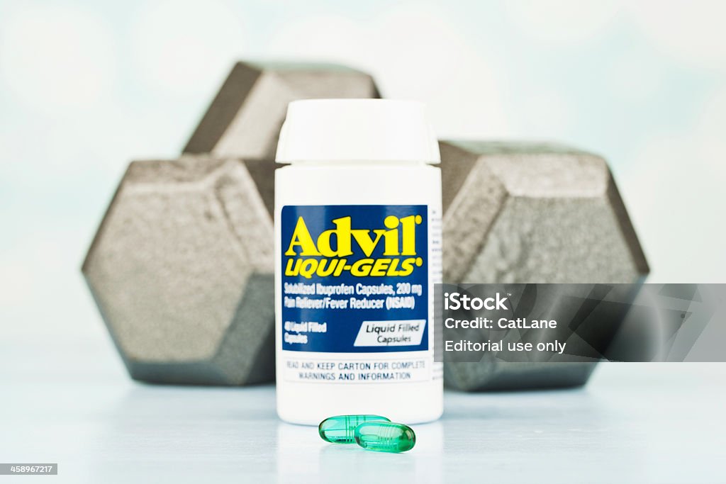 筋肉の痛みを緩和 - Aspirinのロイヤリティフリーストックフォト