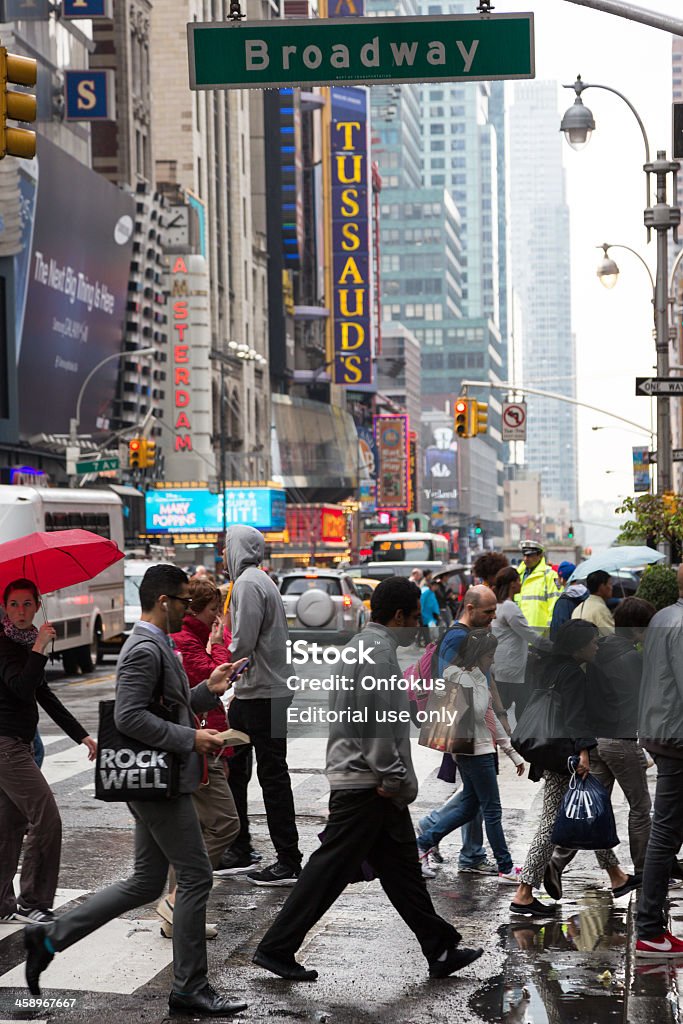 New Yorkers Walking on Broadway Avenue New York City, USA - September 28, 2012: New Yorkers walking on famous Broadway Avenue on a cloudy and rainy day. Outdoors Stock Photo