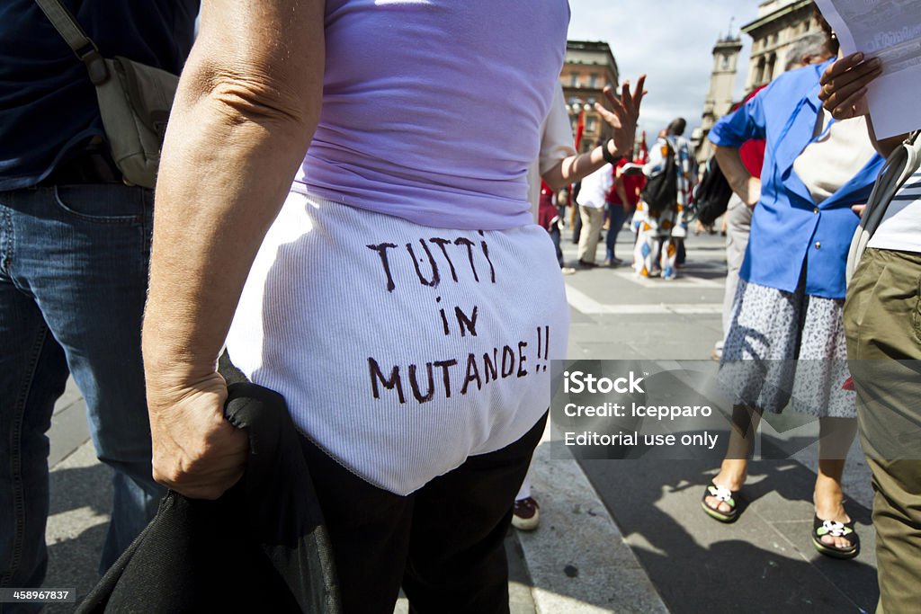 Protest Against Government New Economic Policy Milan Italy "Milan, Italy - September 6, 2011: People protesting against italian government new economic policy. A woman wearing underpants on which is written ""We have nothing left but our underpants"" in italian language." Adult Stock Photo