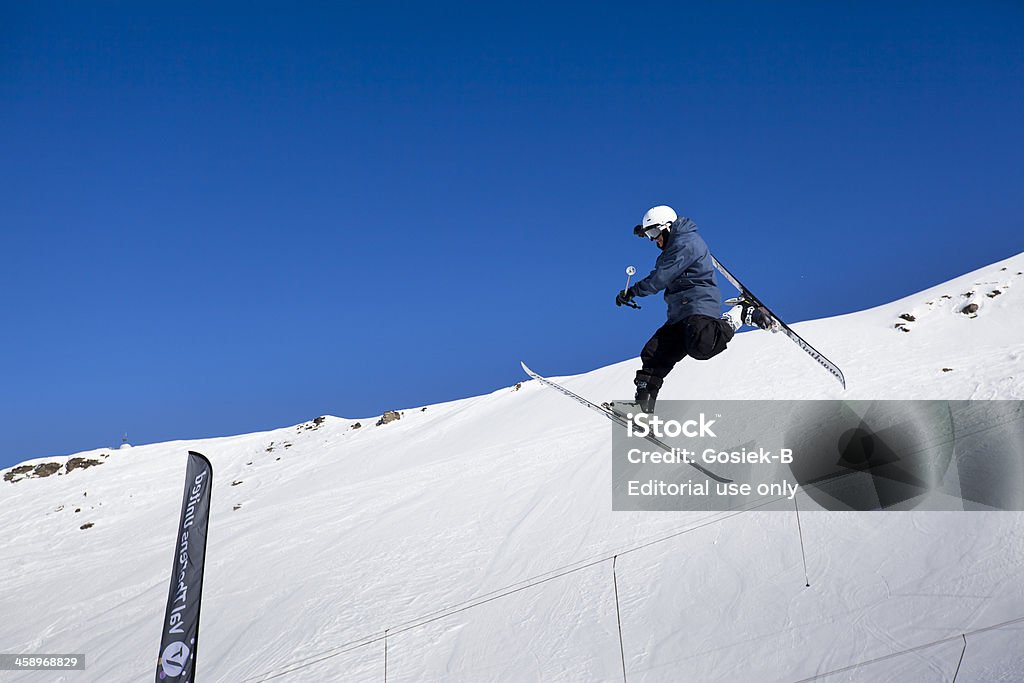 skier jumping "Val Thorens, France - January 25, 2013: A skier flies through the air performing a trick in the French Alps. This image was captured atVal Thorens and Snowboard Resort. Val Thorens is the most popular ski resort in France (Les Trois Vallees)." Big Air Stock Photo