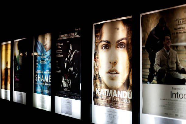 Film releases "Malaga, Spain - March 2, 2012: Posters advertising forthcoming film releases on billboards outside a cinema in Malaga, Spain" film poster stock pictures, royalty-free photos & images