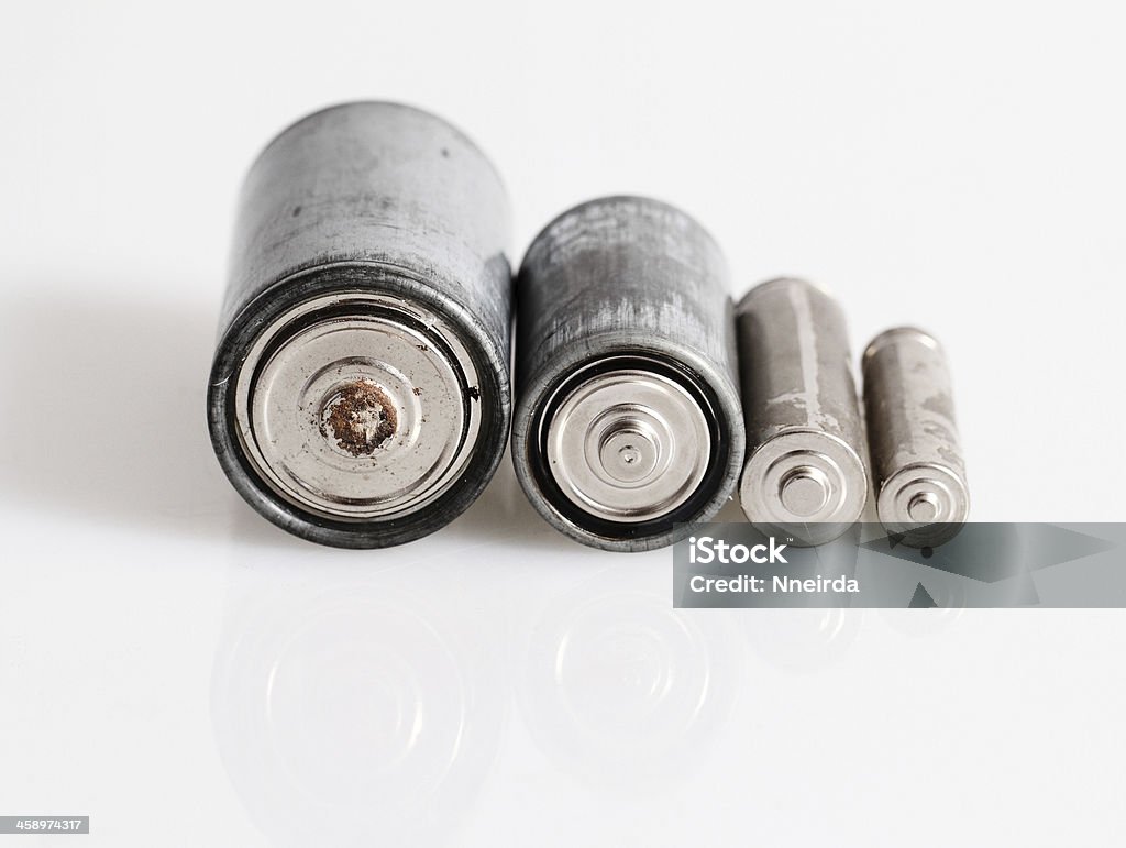 Old batteries Old batteries isolated on white background Battery Stock Photo