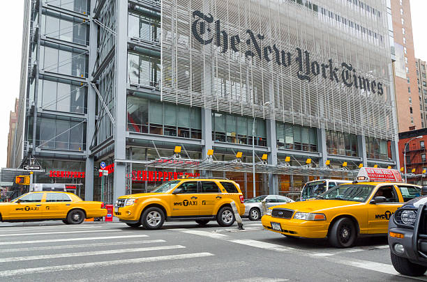 New York Times headquarters "New York city, USA - April 22, 2012: Three yellow cabs pass in front of the New York Times headquarters in New York as thestreet light turns to green." 42nd street photos stock pictures, royalty-free photos & images