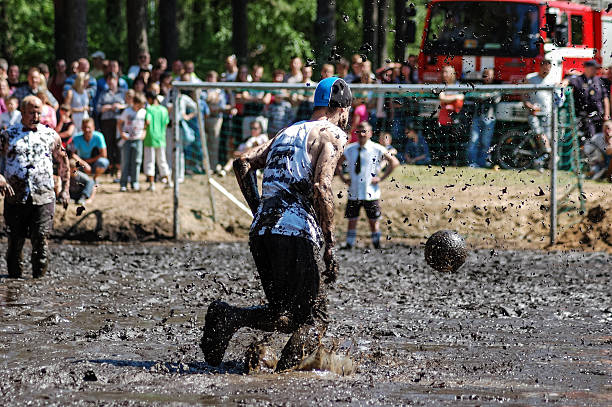 глиняная футбол - mudball стоковые фото и изображения