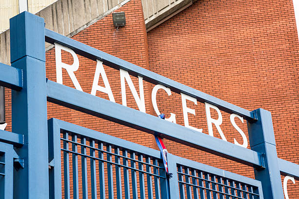 Ibrox Stadium, Glasgow "Glasgow, UK - July 21, 2012: The Rangers Football Club sign over the gates between the Main Stand and the Broomloan Road Stand at Ibrox Stadium, Glasgow, the home ground of Rangers Football Club." ibrox stock pictures, royalty-free photos & images