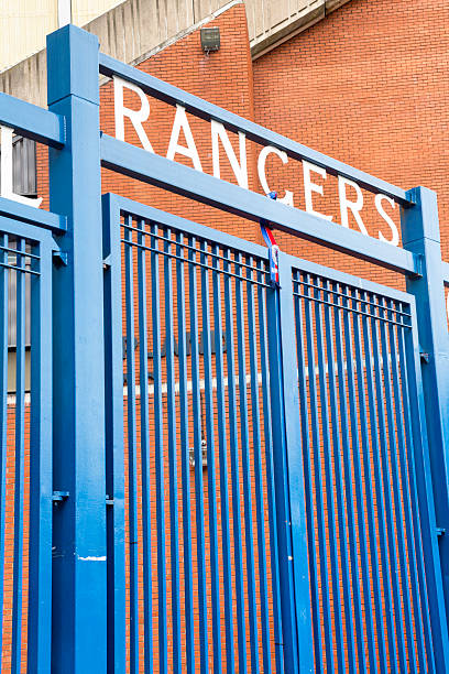 Ibrox Stadium, Glasgow "Glasgow, UK - July 21, 2012: The Rangers Football Club sign over the gates between the Main Stand and the Broomloan Road Stand at Ibrox Stadium, Glasgow, the home ground of Rangers Football Club." ibrox stock pictures, royalty-free photos & images
