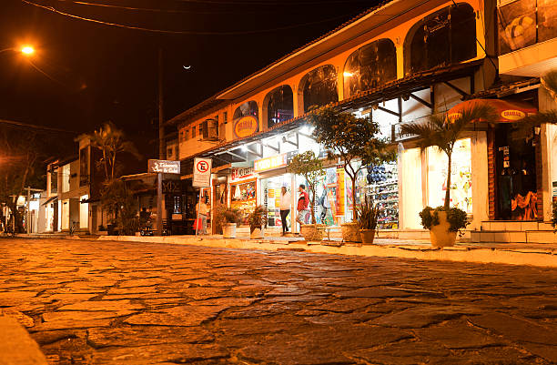 Colourful Paraty architecture, Paraty town, Brazil. Paraty, located on the Costa Verde (Green Coast) is a well preserved Portuguese colonial and Brazilian Imperial municipality - the name originating from the local Guaianá Indians' indigenous Tupi language, for an abundant local fish native to the region. Paraty has become a tourist destination, known for its historic town centre and surrounding coast and mountains.