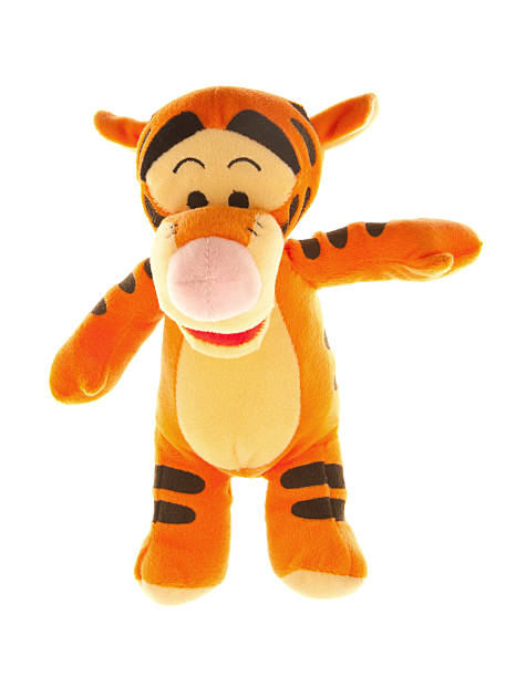 Tigger from Winnie-the-Pooh Books "Albuquerque, USA- November 1, 2012: Tigger is a popular character from Winnie-the-Pooh childrens books. The stories, popular worldwide, were written by A. A. Milne and they feature adventures of a teddy bear called Winnie-the-Pooh and his friends Piglet, Eeyore, Owl, Tigger and,  Rabbit. Tigger with his bouncy tail is full of enthusiasm for the joy in life. He does not think about the consequences and thus gets often in trouble." winnie the pooh photos stock pictures, royalty-free photos & images