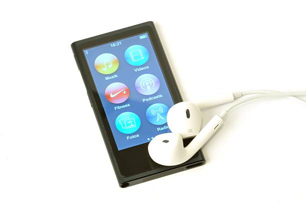 Apple ipod nano "Heidenheim, Germany - January 17, 2013:Studio shot of an Apple ipod nano graphit with EarPods showing home screen, bluetooth activated" ipod nano stock pictures, royalty-free photos & images