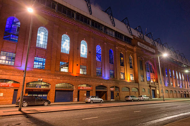 Ibrox Stadium, Glasgow "Glasgow, UK - December 5, 2012: The Bill Struth Main Stand at Ibrox Stadium, Glasgow, the home ground of Rangers Football Club. The main stand was built in 1928 with an impressive red brick facade. Shot at night as the club is celebrating its 140th anniversary." ibrox stock pictures, royalty-free photos & images