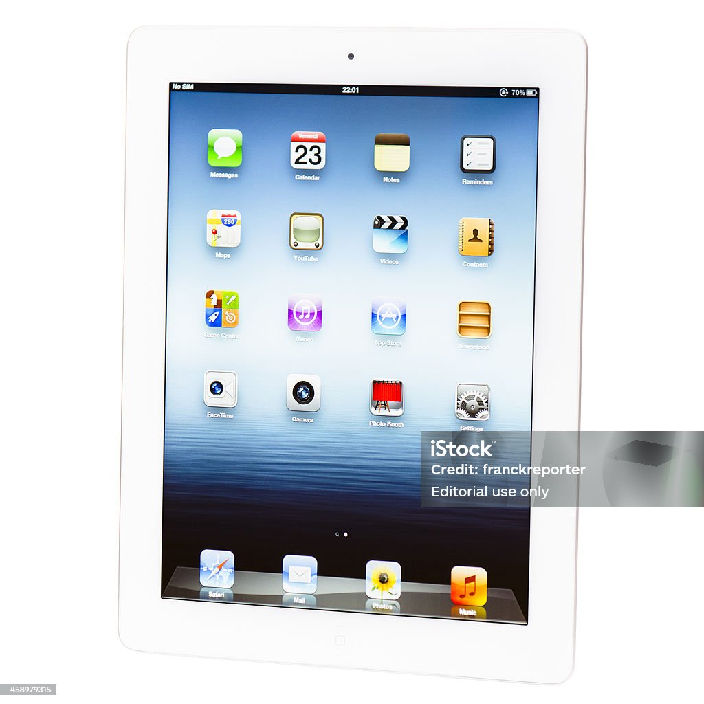 The new Apple Ipad 3 white version isolated "Florence, Italy - March 23, 2012: The new Apple Ipad 3 16 GB white version on a table with white background. The iPad 3 is the new device made by Apple inc. California . It was presented to the public on 7 march 2012. The most important features of this new digital tablet are the Retina display and the camera of 5Mpixel." Big Tech Stock Photo