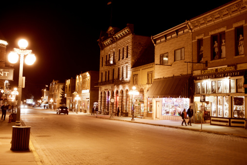 Deadwood, South Dakota, United States - March 9, 2012. People on the Main Street of historic Deadwood, South Dakota. The signs and buildings still reflect the era in which it's rich history was forged.