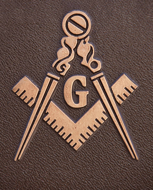 Freemasonry Square and Compasses "Deadwood, South Dakota, United States - March 10, 2012. Close up of Freemasonry symbol Square and Compasses. The Square and Compasses is the most identifiable symbol associated with Freemasonry." masonic symbol stock pictures, royalty-free photos & images