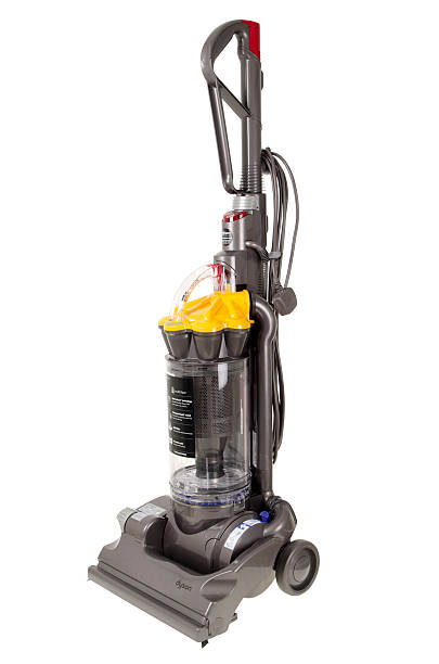 Dyson DC33 Multi Floor Upright Vacuum Cleaner "Helston, Cornwall, UK - August 17, 2012: A Dyson DC33 bagless upright vacuum cleaner. This is the Multi Floor version denoted by the yellow top. This is a product of Dyson Ltd. An innovative British company." dyson brand name photos stock pictures, royalty-free photos & images