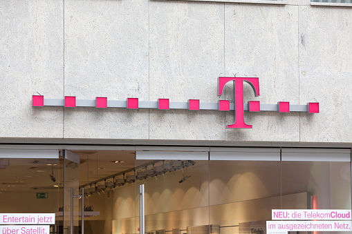 Munich, Germany - February 18, 2012: Logo of Deutsche Telekom on a shop in Munich, Germany. There are around 750 so called 
