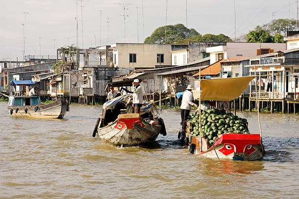 Traders on boats in Mekong Delta stock photo