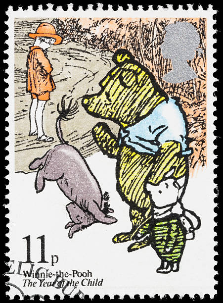 UK Winnie-the-Pooh postage stamp "Sacramento, California, USA - October 11, 2012: A 1979 UK postage stamp with an illustration of a scene from the well-known children's book by A. A. Milne, 'Winnie-the-Pooh'. Issued as part of a series commemorating the UN designation of 1979 as 'The Year of the Child'." a.a. milne stock pictures, royalty-free photos & images