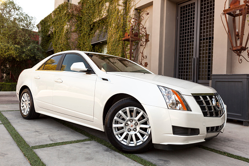 Scottsdale, United States - March 8, 2012: A photo of a white parked 2012 Cadillac CTS coupe, the CTS is Cadillacs most popular luxury sedan.