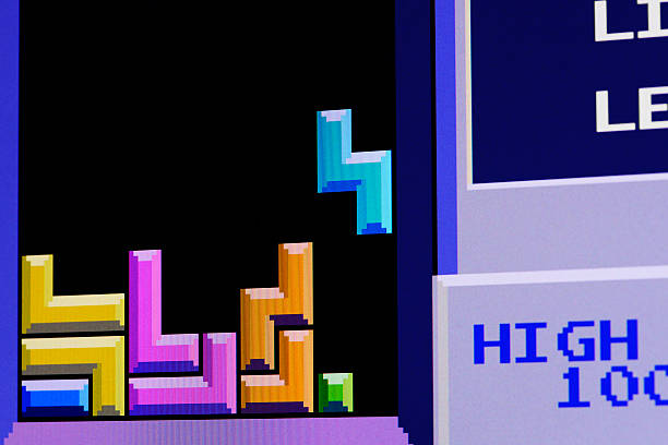 Close up of vintage classic videogame on computer monitor Borgosesia, Italy - September 1, 2012: Close up of vintage classic videogame on computer monitor: Tetris by Atari block stacking video game stock pictures, royalty-free photos & images