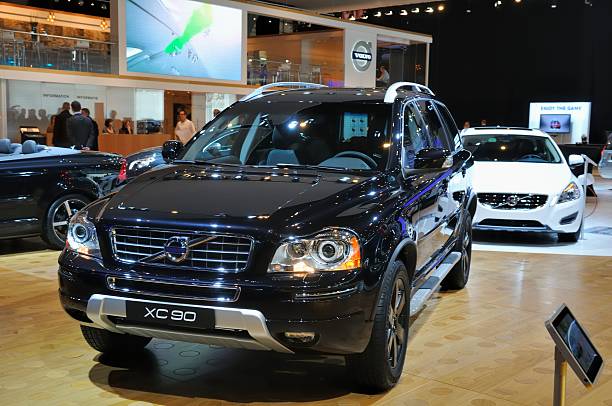 Volvo XC90 Brussels, Belgium - January 10, 2012: Black Volvo XC90 SUV on display during the Brussels motor show. People in the background are looking at the cars. volvo stock pictures, royalty-free photos & images